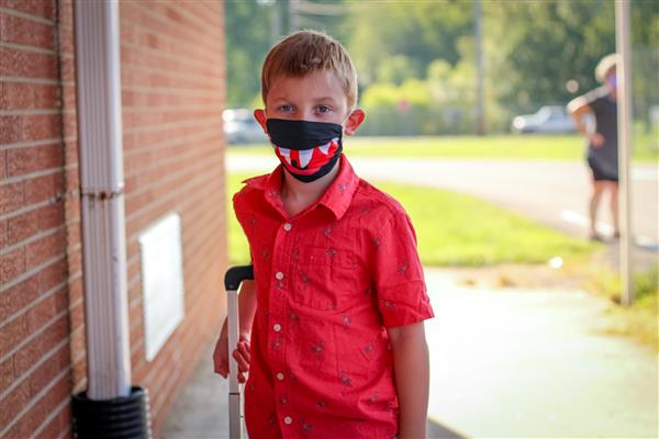 student smiles on first day of school
